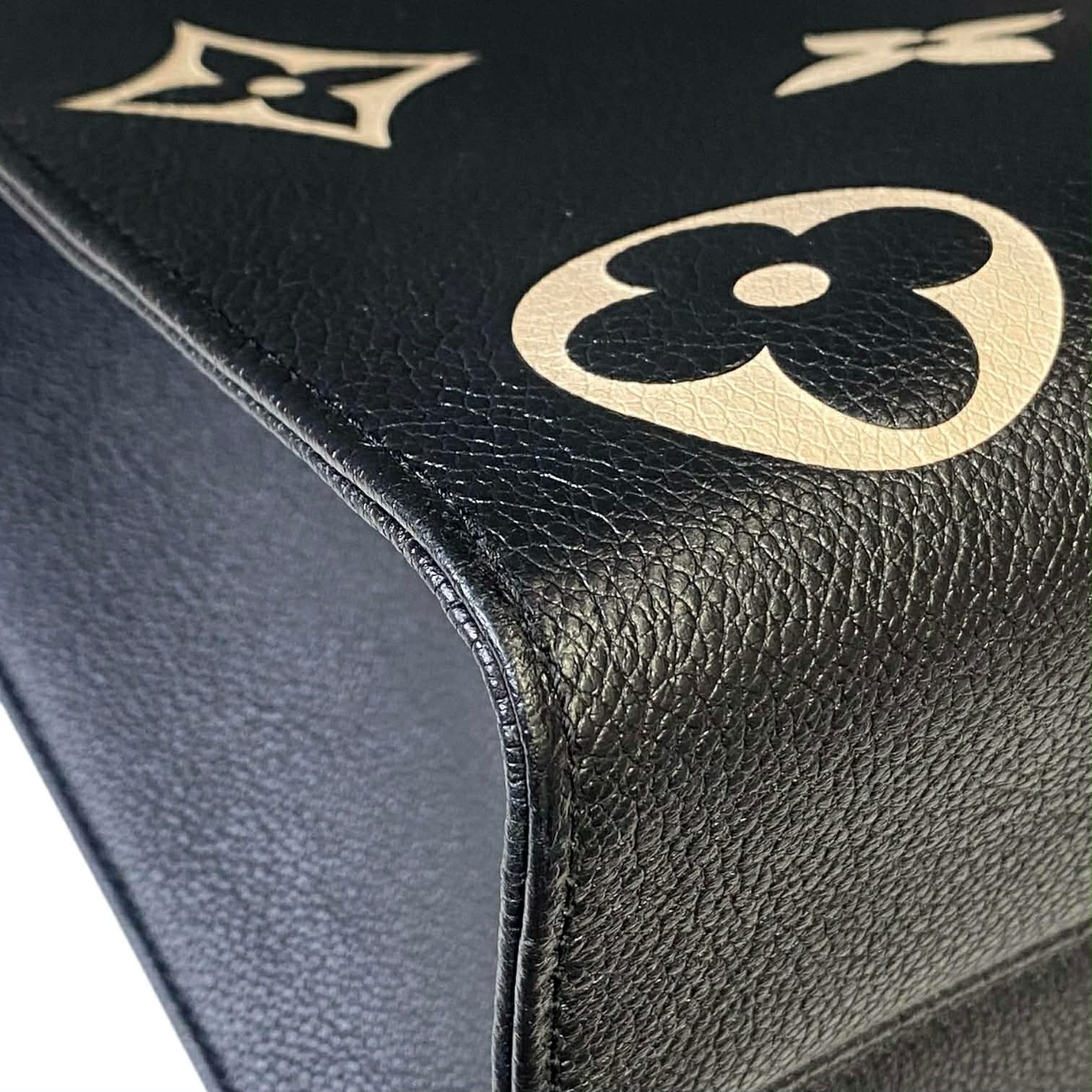 Louis Vuitton On The Go MM Empriente Leather Black and Ivory