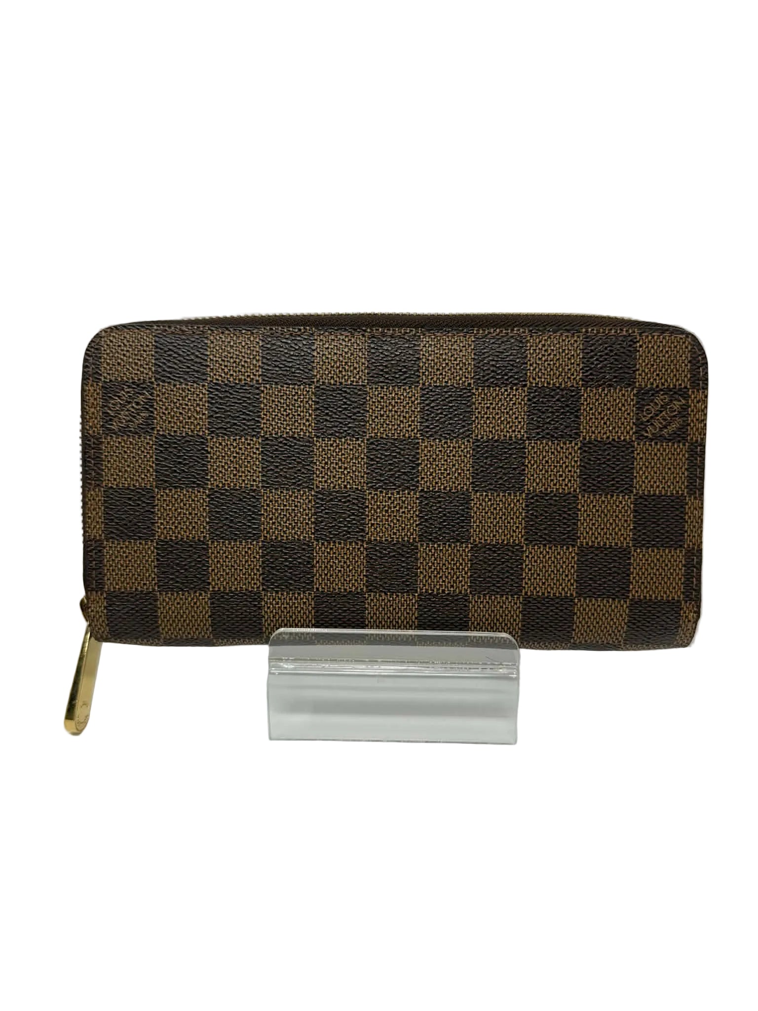 Brown checkered wallet on a white background