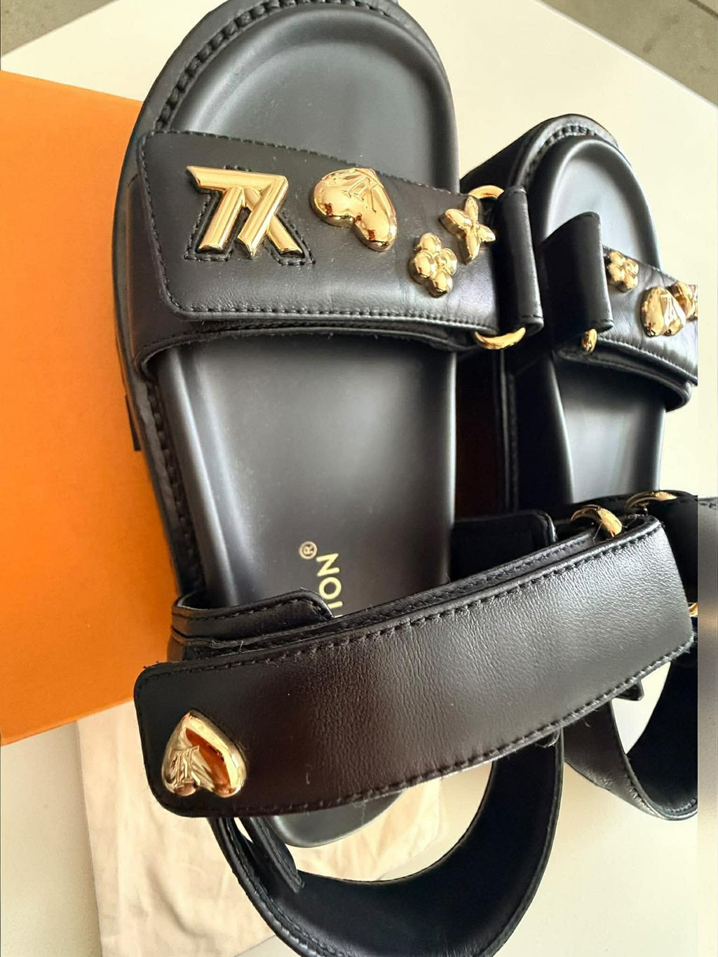 Louis Vuitton	Sunset Platform Comfort Sandal platform Black with Gold Charms