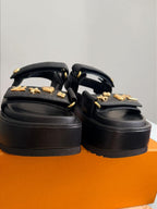 Louis Vuitton	Sunset Platform Comfort Sandal platform Black with Gold Charms