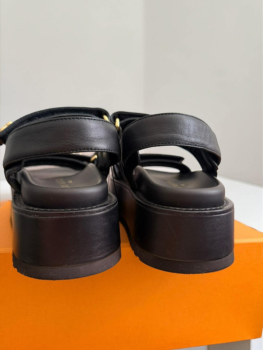 Louis Vuitton	Sunset Platform Comfort Sandal platform Black with Gold Charms