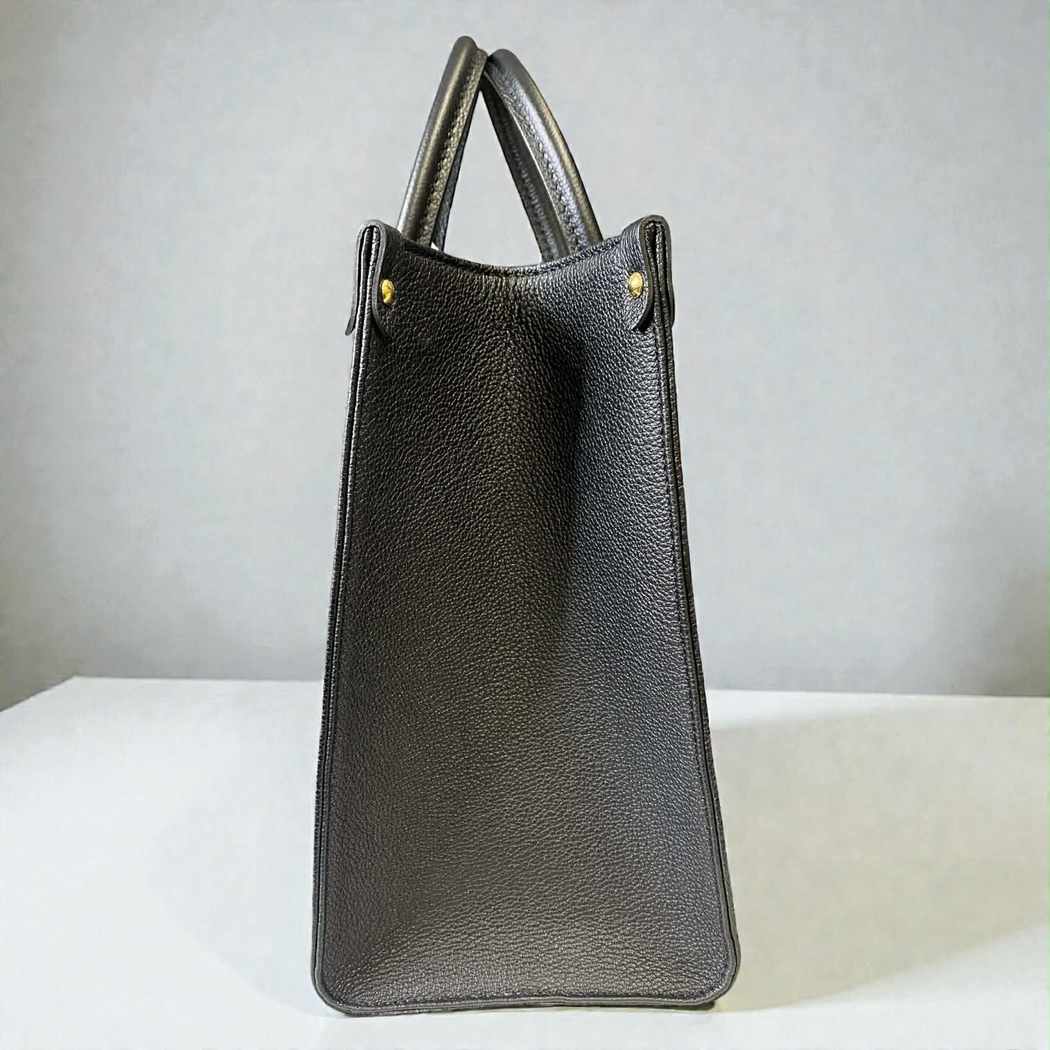 Louis Vuitton On The Go MM Empriente Leather Black and Ivory